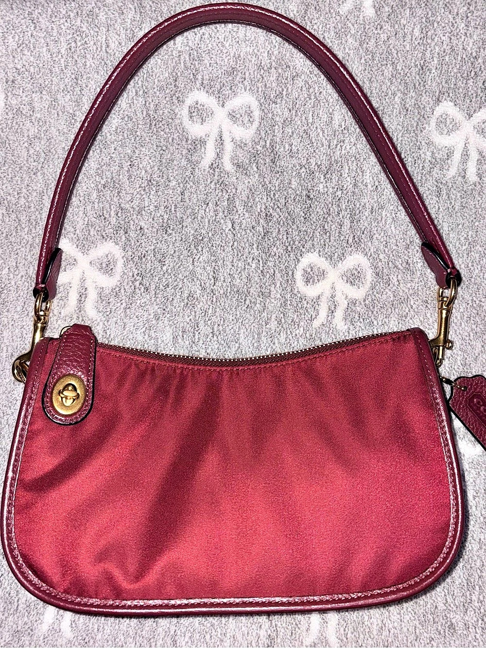 COACH Nylon swinger 20 in wine color